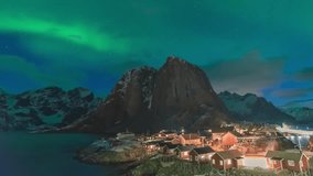 Lofoten Norway time lapse of the aurora borealis northern lights winter landscape at Hamnoy fisherman village - Powered by Shutterstock - Get 15% off with code: PIKWIZARD15
