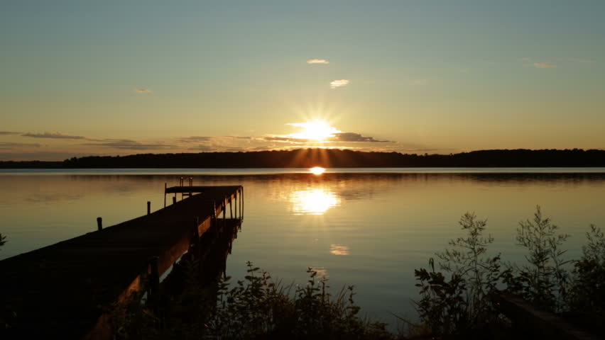 Sunrise over a small lake in Michigan, USA.