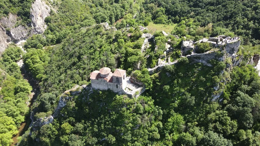 Aerial Spring view of Church of the Holy Mother of God at ruins of Medieval Asen Fortress, Asenovgrad, Plovdiv Region, Bulgaria