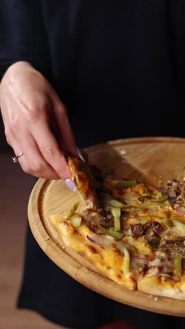 They are eating pizza. Close-up