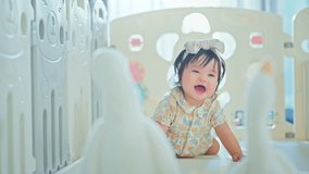 Little asian Infant baby girl 6-12 months playing with her goose doll at home, Little Toddler having fun in living room, Enhance development. - Powered by Shutterstock - Get 15% off with code: PIKWIZARD15