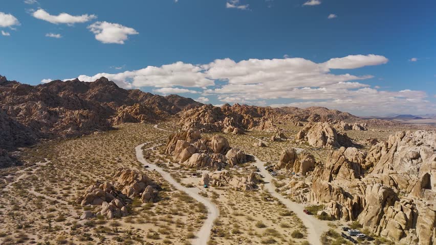 Rock Formations In Joshua Tree National Park By The Park Boulevard In California, USA. Aerial Drone Shot