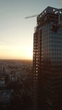 development of modern office skyscraper building made of glass and steel, construction site industry, aerial drone view 4k, vertical video - Powered by Shutterstock - Get 15% off with code: PIKWIZARD15