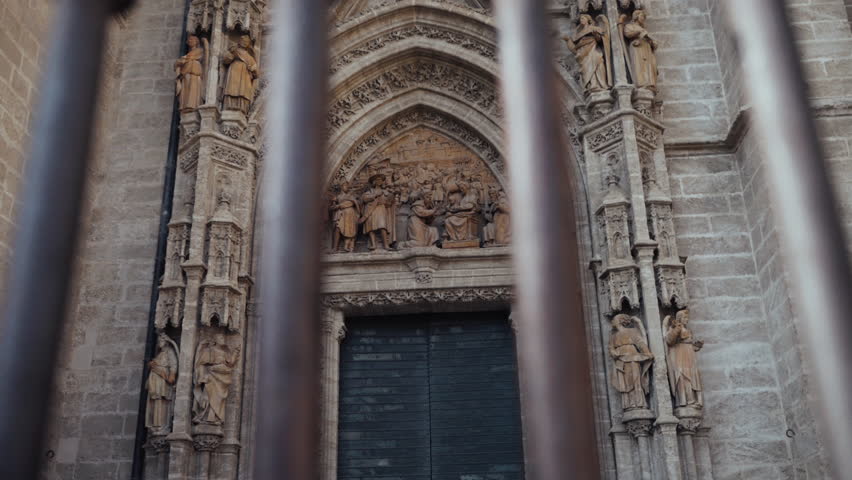 One of the majestic doors of the Giralda, adorned with intricate carvings and Moorish designs, welcomes visitors into a piece of Seville’s history