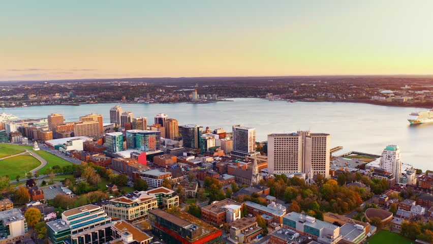 Aerial drone shot over Halifax downtown, Nova Scotia, Canada.
High view of the cityscape, ocean and the urban buildings.