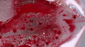 Vertical video. Shiny gel drip. Glitter gloss texture. Blur red color sparkling sequin particles translucent water ink spill motion pyramid abstract art background with bokeh lights. - Powered by Shutterstock - Get 15% off with code: PIKWIZARD15