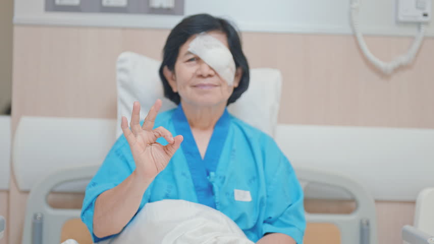 Elderly Woman with eye protective shield after eye surgery. Eye disease, Cataract,  Glaucoma, Age Related Macular Degeneration, Diabetic Retinopathy, Vitreous, Lasik, World Glaucoma day and health 
