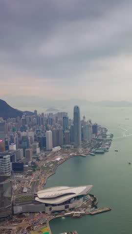 rainy day hong kong famous harbor traffic cityscape aerial vertical timelapse panorama 4k hong kong