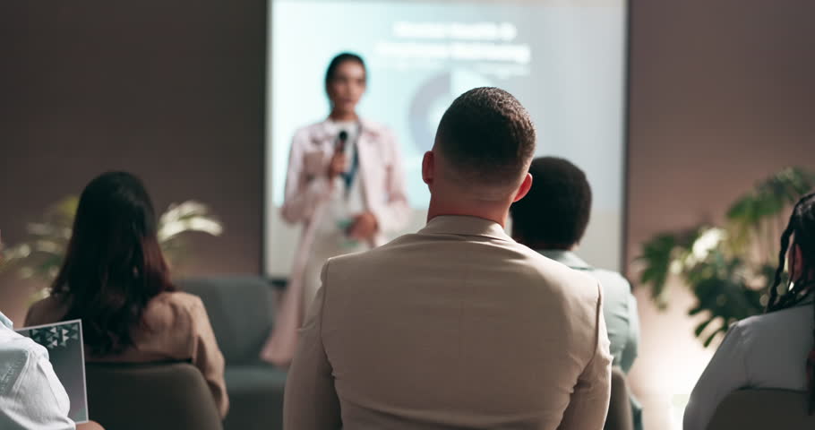 Business people, seminar or presentation with question in audience for interaction, feedback or engagement at office. Group, speaker or employee with hands raised for proposal or speech at convention