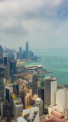 sunny day wan chai district hong kong cityscape harbour bay aerial vertical timelapse panorama 4k hong kong