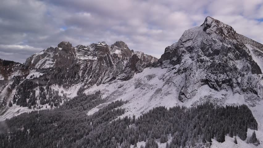 Fronalpstock mountains Swiss Alps alpine cold winter snow covered nature forest, drone