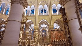 Beautifully gilded golden altar inside the Notre Dame cathedral under ornate stained-glass windows, Paris, France. - Powered by Shutterstock - Get 15% off with code: PIKWIZARD15