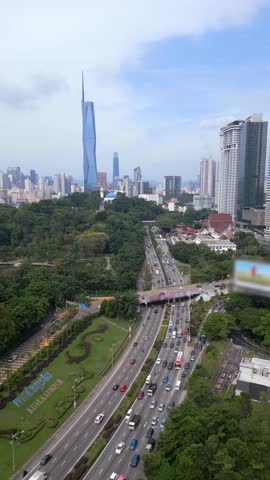 Aerial view of morning traffic on highway and Kuala Lumpur city skyline, Malaysia
