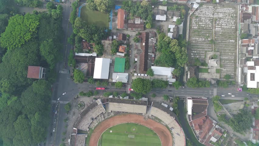 FOOTAGE DRONE VIDEO VIEW FROM TOP OF A FOOTBALL STADIUM FROM ABOVE WITH CLEAN WEATHER