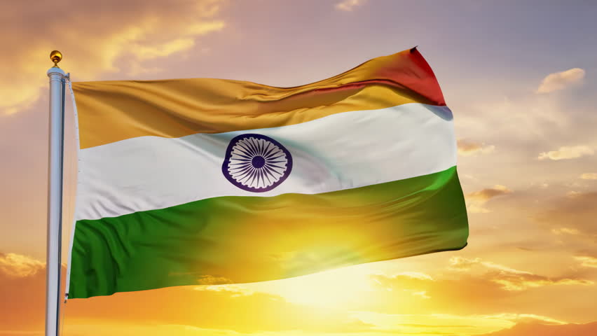 Indian flag flutters against bright blue sky. Patriotic tricolor background. India symbol waves proudly. Tall flagpole. Patriotism and national pride concept. Great sign.