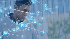 Using laptop, man browsing digital shopping with security icons overlay. Online shopping, cybersecurity, technology, e-commerce, internet, protection - Powered by Shutterstock - Get 15% off with code: PIKWIZARD15