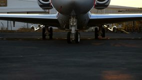 Private jet parked on tarmac with financial data processing animation overlay. Aviation, luxury, finance, technology, business travel, innovation - Powered by Shutterstock - Get 15% off with code: PIKWIZARD15