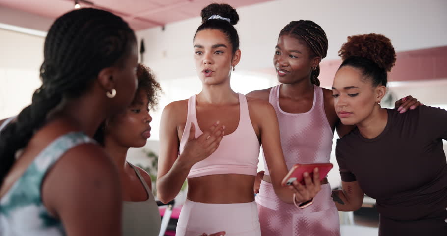 Group, people and talking with phone in yoga class for streaming video, research and fitness guide. Instructor, explain and women with mobile for social media, pilates website and online instructions
