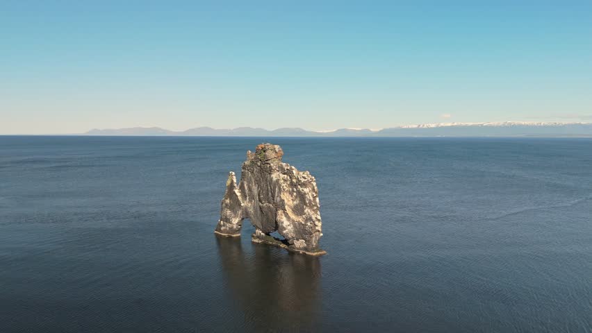 A Stunning Aerial Shot Of Hvitserkur, The Majestic Basalt Rock Stack In Northwest Iceland. Known As The Troll, This Unique Natural Landmark Stands Tall Against The Icelandic Coastal Landscape.