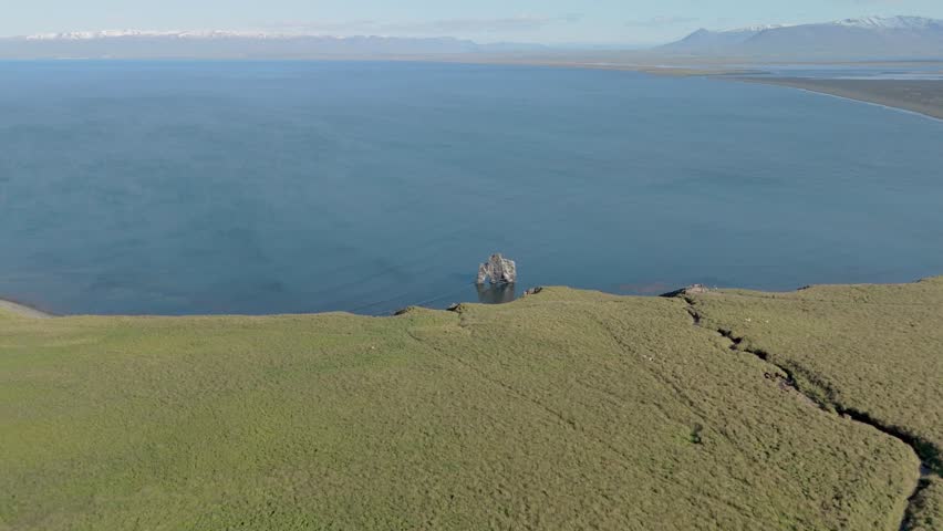 Aerial Footage Capturing Hvitserkur, A Majestic Basalt Rock Stack On The Coast Of Northwest Iceland. Known As The Troll, This Fascinating Formation Is A Key Natural Wonder Of The Icelandic Landscape.