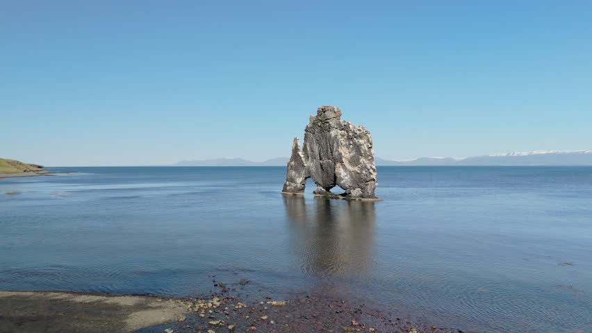 Breathtaking Aerial View Of Hvitserkur, The Basalt Rock Stack In Northwest Iceland. This Unique Landmark Resembles A Troll And Stands Tall Over The Icelandic Waters, Captivating All Who See It.