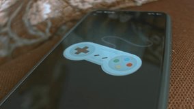Game controller themed graphic presentation on smartphone - Powered by Shutterstock - Get 15% off with code: PIKWIZARD15