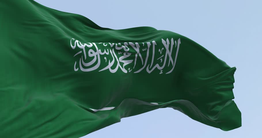 Close- up of the Saudi Arabian national flag waving in the wind. Green field with Shahada and sword in Thuluth script. Seamless 3d render animation. Slow motion loop. Selective focus. Cinema 4k