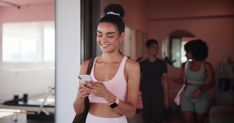 Gym, woman and happy with mobile for fitness, virtual tutorial and communication on social media. Health club, female person and laughing with smartphone for application, exercise meme and walking