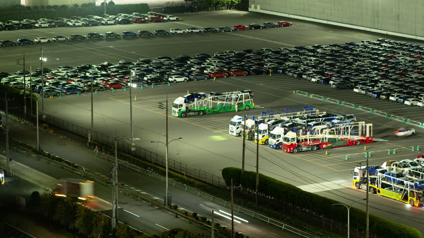Motor Vehicles Unloaded from Autoracks and Lined up at Port, Wainting to Be Exported (Timelapse | PANNING)