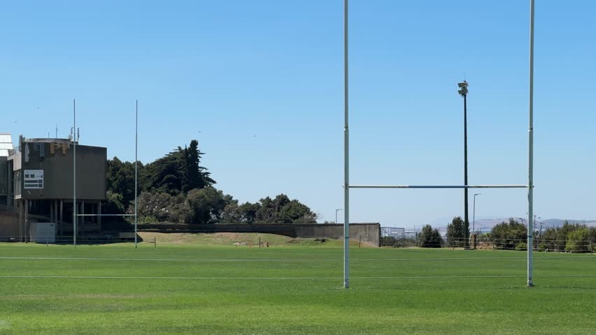 Rugby poles on the university campus field at University of Cape Town’s upper campus. Cape Town, South Africa.