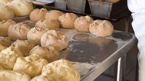 Baker preparing sourdough bread dough on a clean, flour-covered countertop - Powered by Shutterstock - Get 15% off with code: PIKWIZARD15