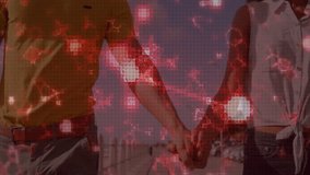 Red digital network animation over diverse couple smiling and holding hands. Technology, networking, connection, happiness, bonding, diversity - Powered by Shutterstock - Get 15% off with code: PIKWIZARD15