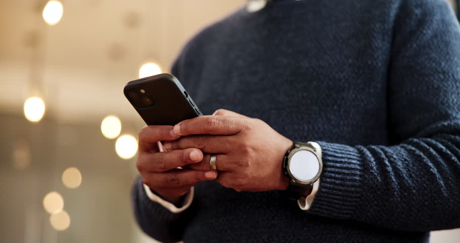 Man, hands and typing with phone at night for online booking, reservation or stay at luxury hotel. Closeup, male person or texting with mobile smartphone for accommodation app or hospitality at inn