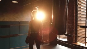 Woman fighter with boxing gloves standing on boxing ring celebrating victory. Woman boxing champion showing raising hands up. Strong powerful girl on boxing ring arena. Competition champion winner - Powered by Shutterstock - Get 15% off with code: PIKWIZARD15