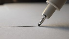 Macro close-up of fineliner pen drawing straight line on white paper, ink flow - Powered by Shutterstock - Get 15% off with code: PIKWIZARD15