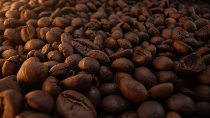 Aromatic Rich Coffee Beans Roasting. Caffeine energy. Ethiopian arabica harvest