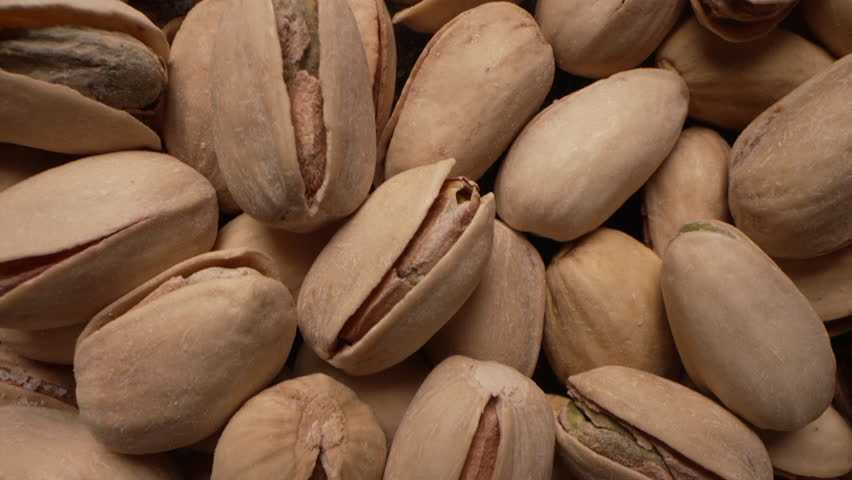 Healthy unpeeled pistachios nuts in shells,macro dolly. Fresh harvest,energy eat