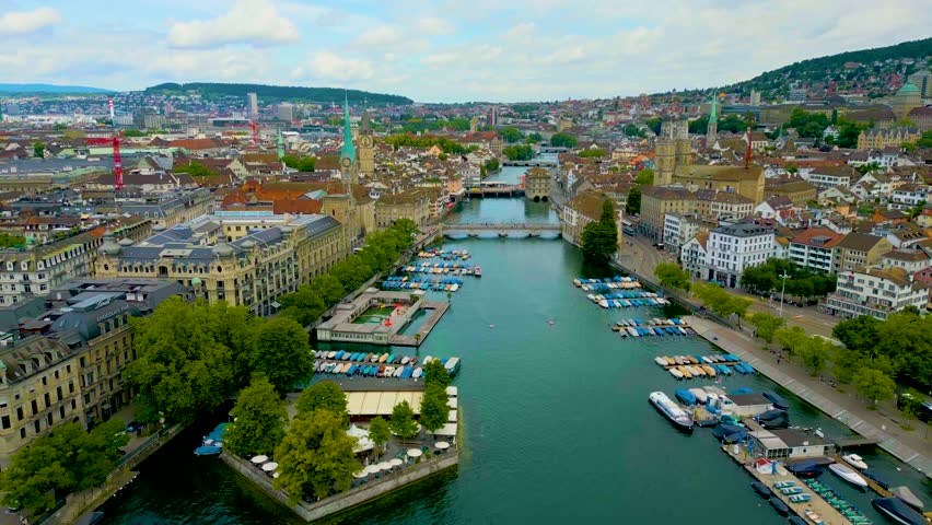 4K Drone Video of the Münsterbrücke and Rathausbrücke Bridges over the Limmat River in Downtown Zurich, Switzerland