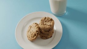 Massive sale text animation over cookies on white plate with blue background. Discount, promotion, bakery, pastry, dessert, shopping - Powered by Shutterstock - Get 15% off with code: PIKWIZARD15