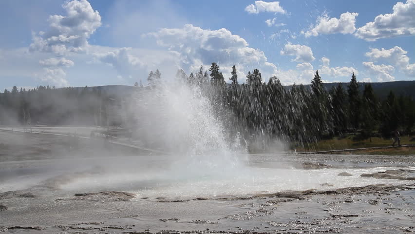 Sawmill Geyser erupting, sending up showers of hot water at Yellowstone Park,