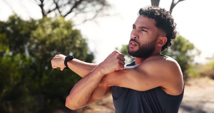 Man, warm up and arms in nature for fitness preparation, outdoor and thinking on wellness goals. Mountain, road and stretching muscle for exercise in countryside, planning and getting ready to train