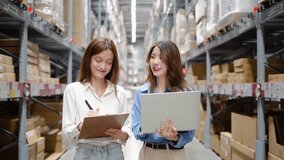 Two young asian women share insights and strategies while inspecting numerous packages and boxes engage in lively discussion while navigating a bustling warehouse filled with packages  - Powered by Shutterstock - Get 15% off with code: PIKWIZARD15