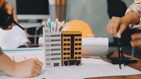 Construction and structure of Engineer or architect meeting for project working with partner and tools on model building and blueprint in working site - Powered by Shutterstock - Get 15% off with code: PIKWIZARD15