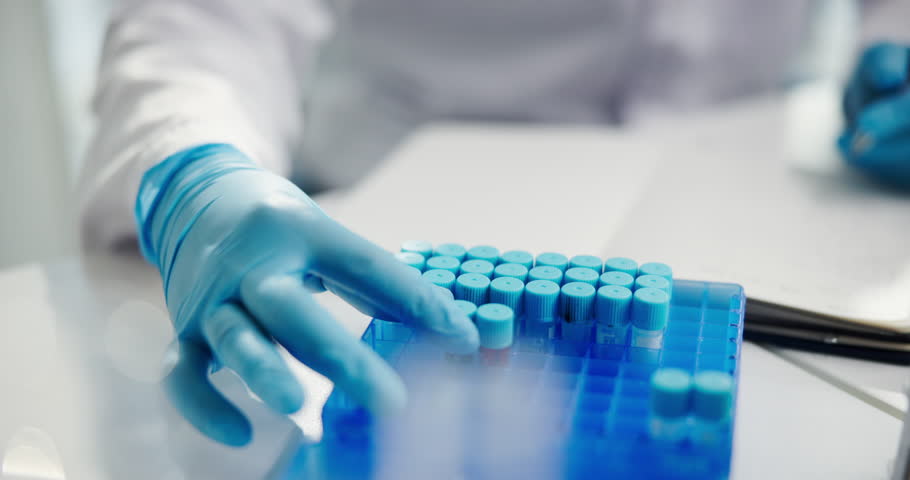 Blood, research and hands of scientist in laboratory with sample for science, medical study or investigation. Healthcare, pharmaceutical and person with DNA test vial, RNA analysis and writing notes