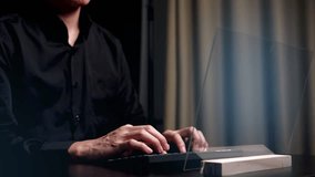 Man in black shirt types on a keyboard, with transparent data charts and analytics displayed in a high-tech overlay. - Powered by Shutterstock - Get 15% off with code: PIKWIZARD15
