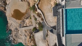 Aerial Video: Cliffside Restaurants Overlooking the Mediterranean Sea With Infinity Pools and a Sandy Beach - Powered by Shutterstock - Get 15% off with code: PIKWIZARD15