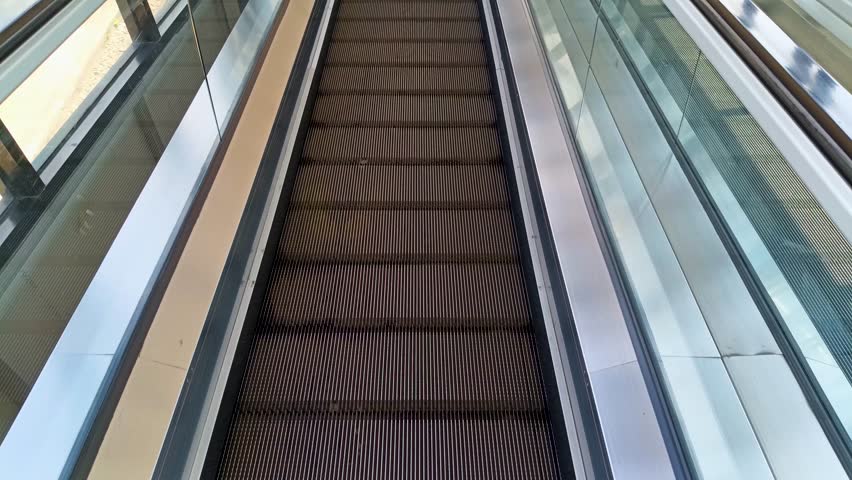 Abstract Geometric Pattern On Modern Escalator System Interior Design Element With Brown And White Accents and Repeating Geometric Shapes And Lines