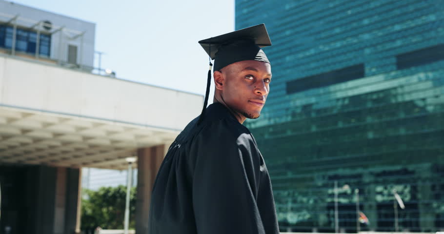 Graduation, student and happy black man in city for celebration, ceremony and achievement. College, school and person thinking for education success, university degree and qualification in town