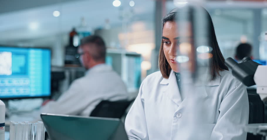 Development, laptop and science with woman in laboratory for investigation of cure, medicine or treatment. Biotechnology, innovation and research with scientist in clinical trial for breakthrough