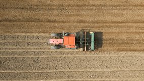 Vertical video. Top view of tractor sowing grain in the farm field - Powered by Shutterstock - Get 15% off with code: PIKWIZARD15